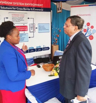 Senior Officer Juliet Wangechi explaining the benefits of KenTrade to a Nairobi based businessman during during a past public event.Photo KenTrade Archive