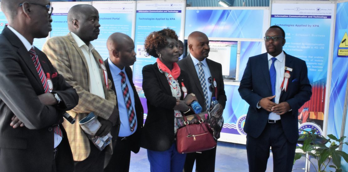 KenTrade Board and senior management staff learn about cargo handling at the Mombasa Port when they visited the Kenya Ports Authority stand at the recent Nairobi International Trade Fair.